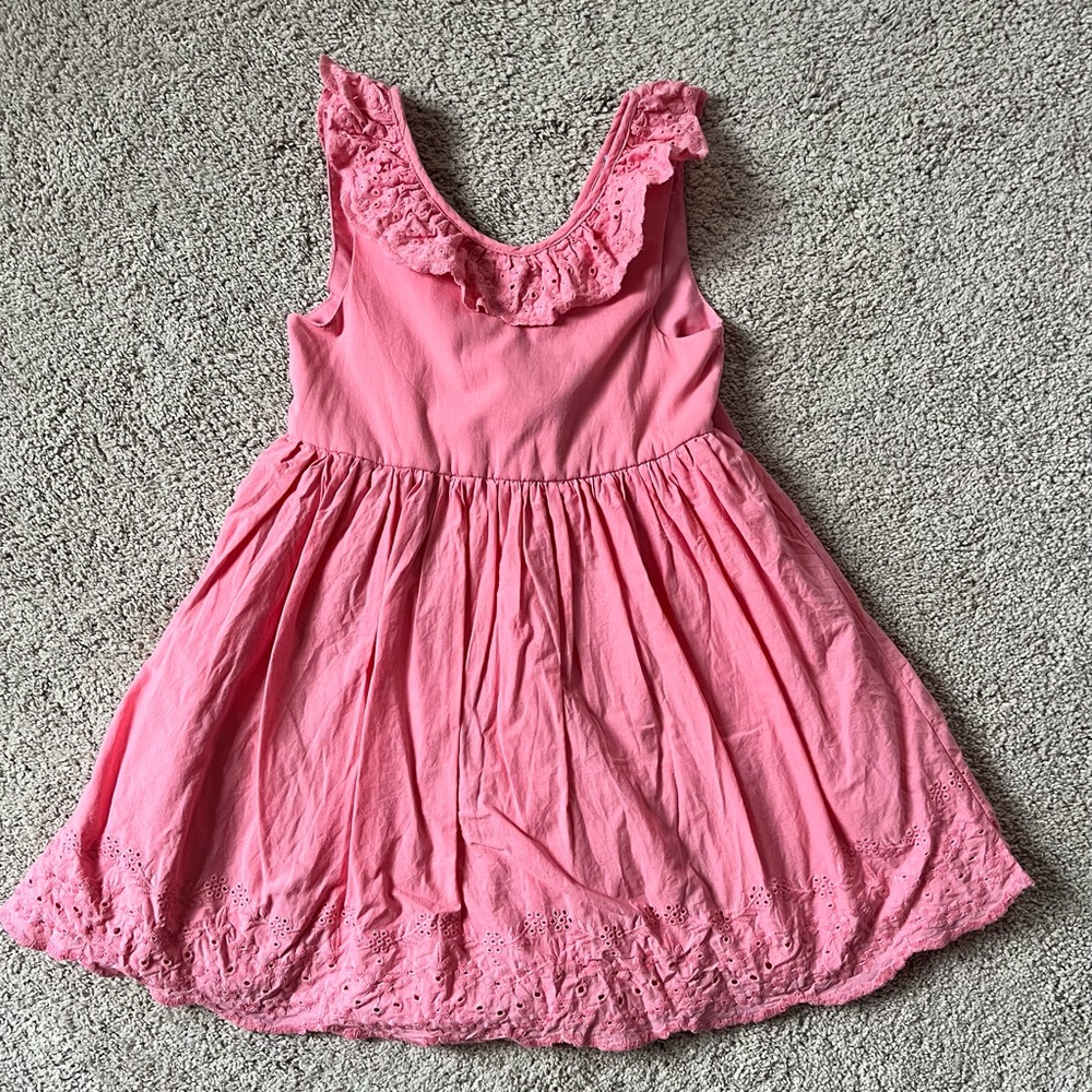 Tahari dress is pink with embroidered details on the neck and hem.